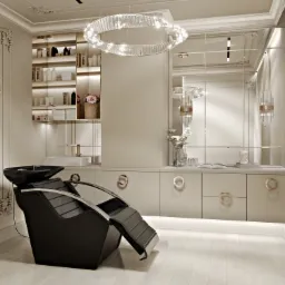 Nowoczesny salon fryzjerski z czarnym fotelem do mycia włosów, oświetleniem LED i lustrami w stylu glamour, kremowe szafki z okrągłymi uchwytami