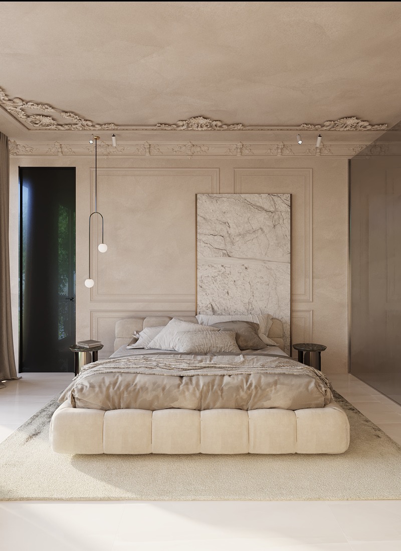 Elegancka sypialnia w beżowych tonacjach z łóżkiem typu platforma, dekoracyjną sztukaterią sufitową i marmurowym panelem za wezgłowiem.