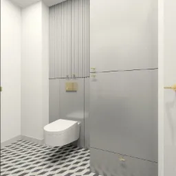Nowoczesna łazienka z wiszącą toaletą, szarą zabudową meblową i geometryczną podłogą w odcieniach bieli i granatu, akcenty w kolorze złotym.