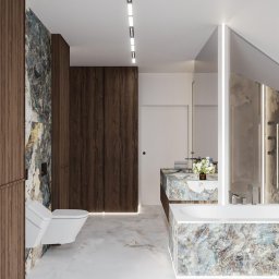 PROJEKTORNIA.COM.PL - Nowoczesna łazienka z marmurowymi akcentami, podświetlane szafy z ciemnego drewna, umywalka z blatem z marmuru, biała wanna i toaleta podwieszana, oświetlenie liniowe na suficie i pod szafkami.