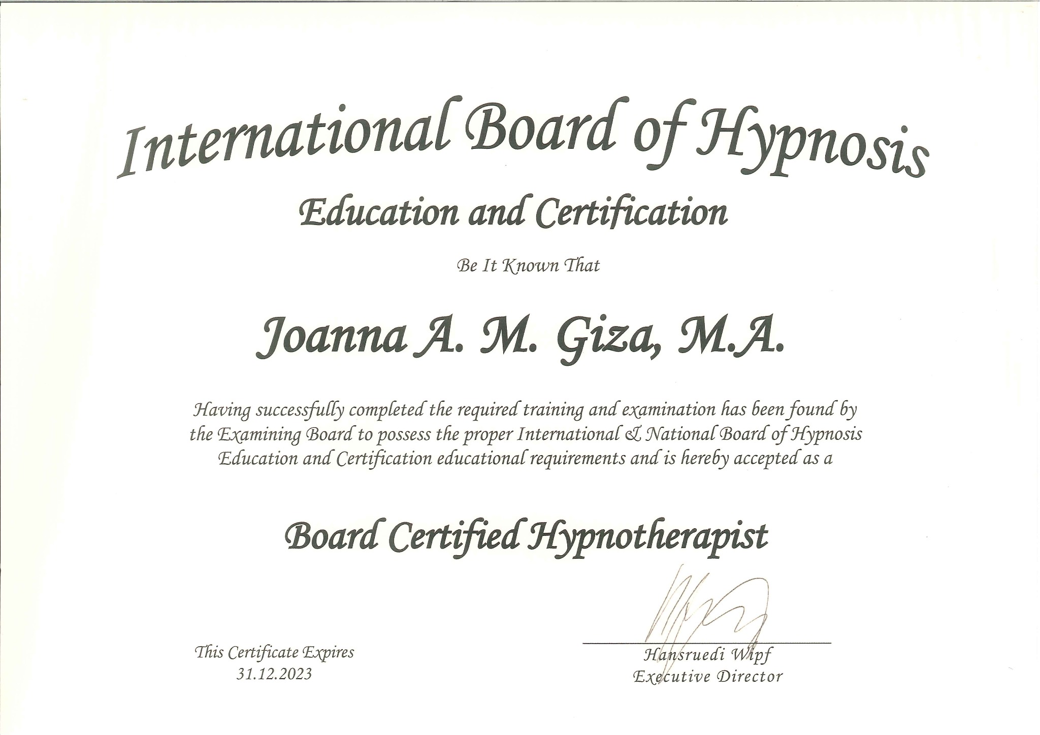 Skan certyfikatu International Board of Hypnosis Education and Certification wydanego dla Joanny A. M. Giza, M.A., potwierdzającego status Board Certified Hypnotherapist, z datą ważności do 31.12.
