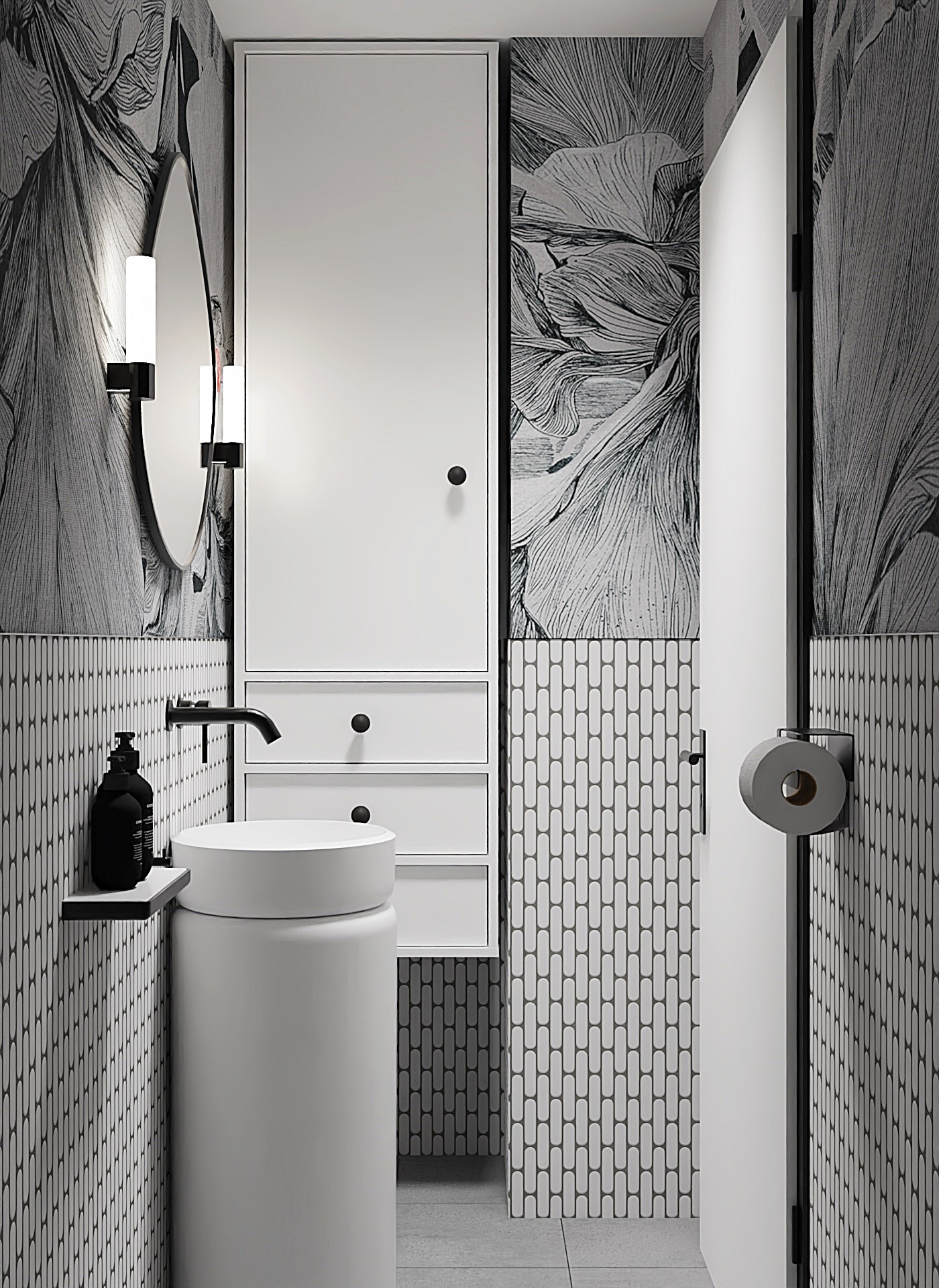 Nowoczesna łazienka w czerni i bieli z umywalką na postumencie, owalnym lustrem z oświetleniem, szafką z szufladami i tapetą w motywy roślinne.