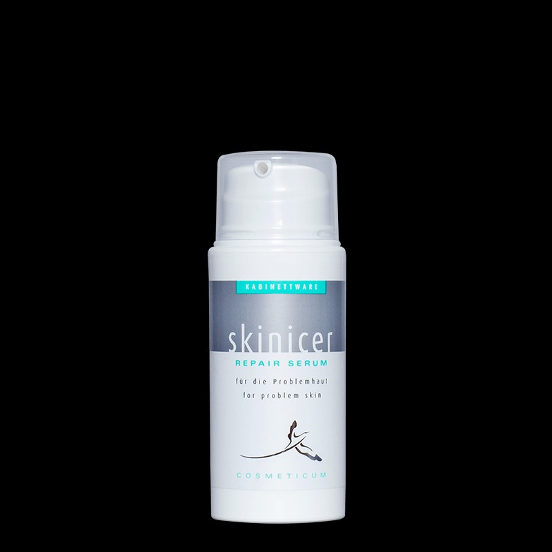 Butelka serum Skinicer Repair Serum do skóry problematycznej na czarnym tle.
