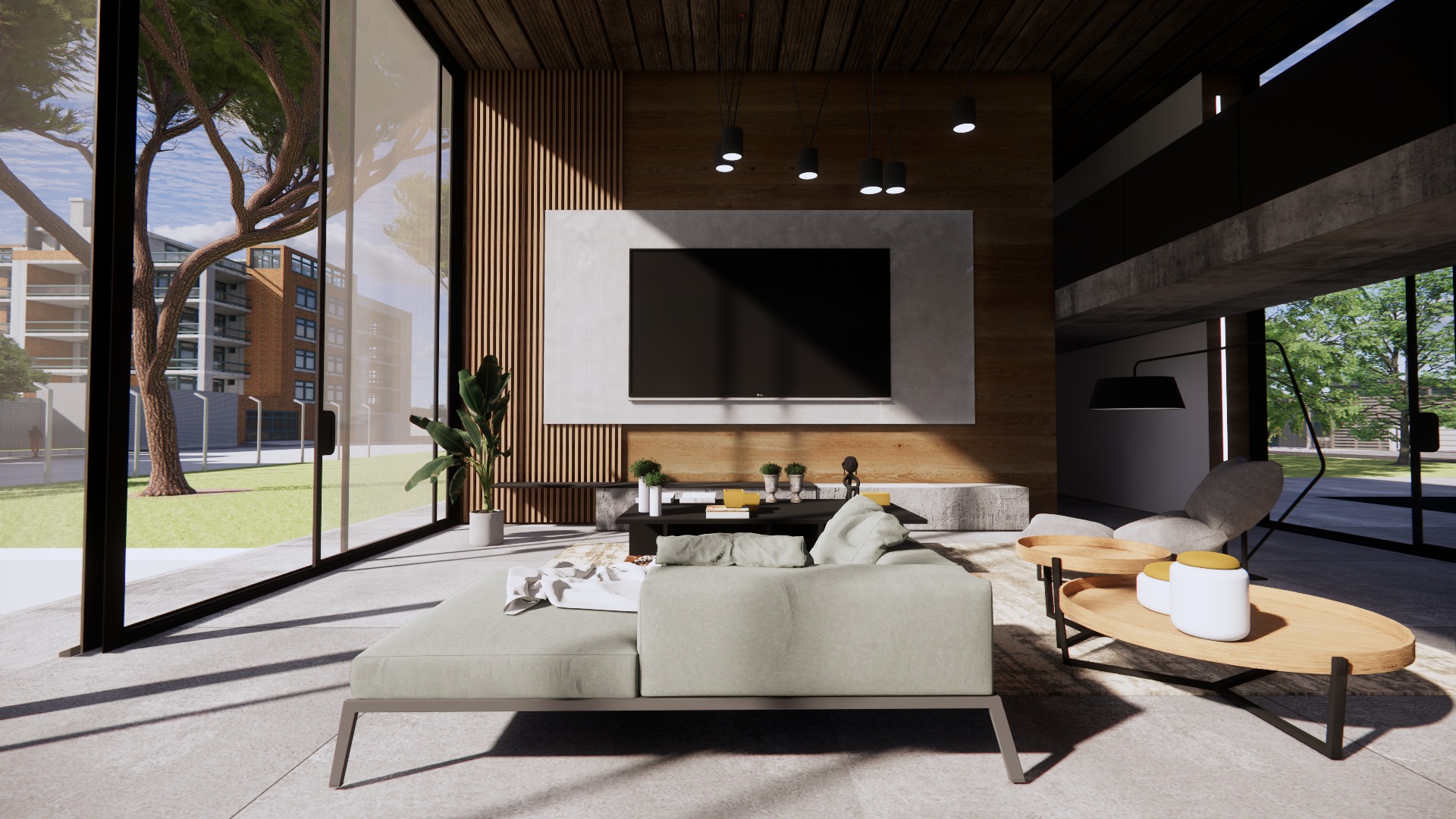 Jasny salon z dużymi oknami, odsłaniającymi widok na zieleń i budynek mieszkalny; drewniana ściana za telewizorem i minimalistyczna sofa w neutralnym odcieniu.