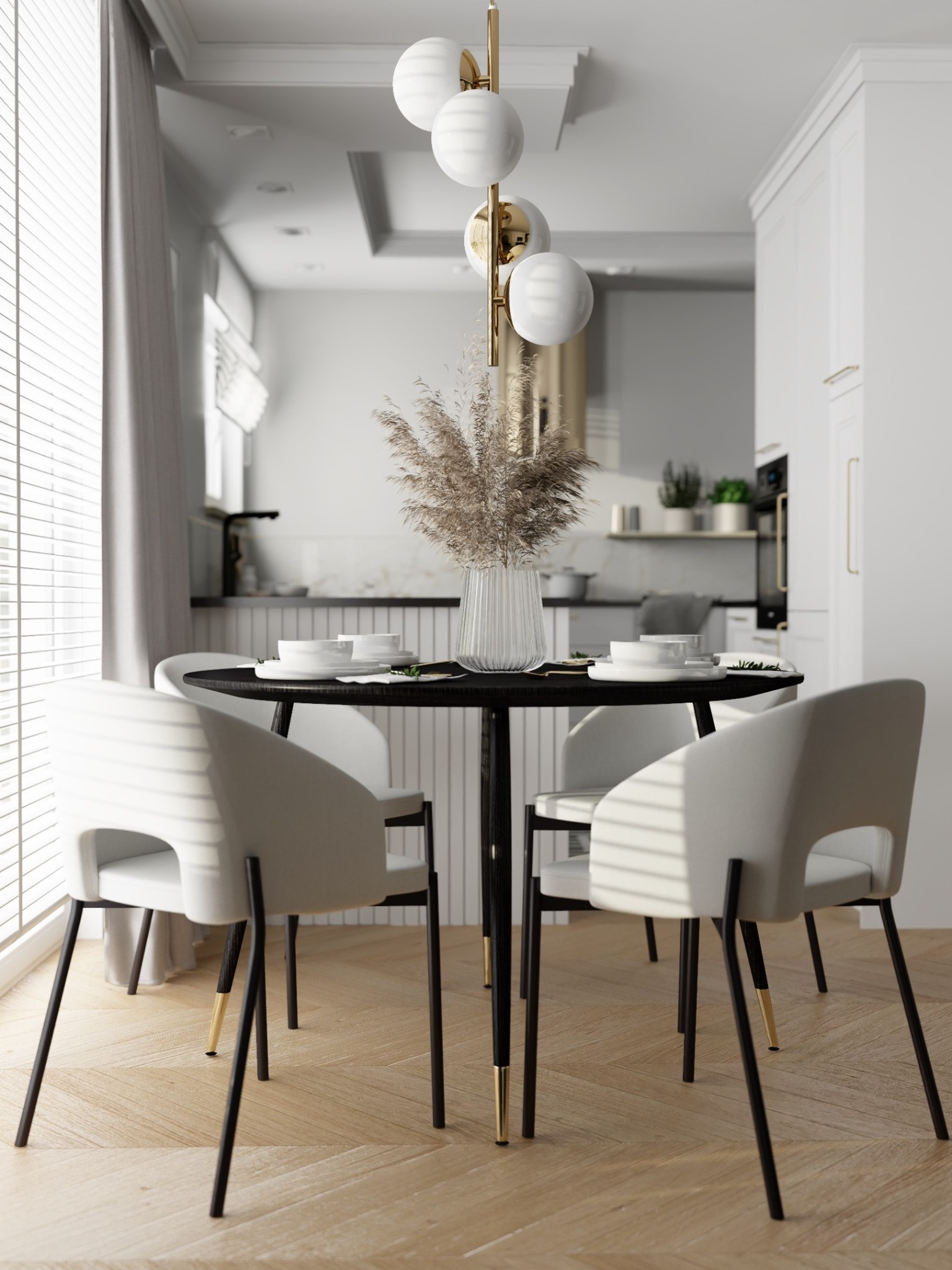Nowoczesna jadalnia z okrągłym, czarnym stołem, białymi krzesłami i dekoracyjnym bukietem w szklanym wazonie, w tle widoczna kuchnia z białymi szafkami i czarnym blatem.