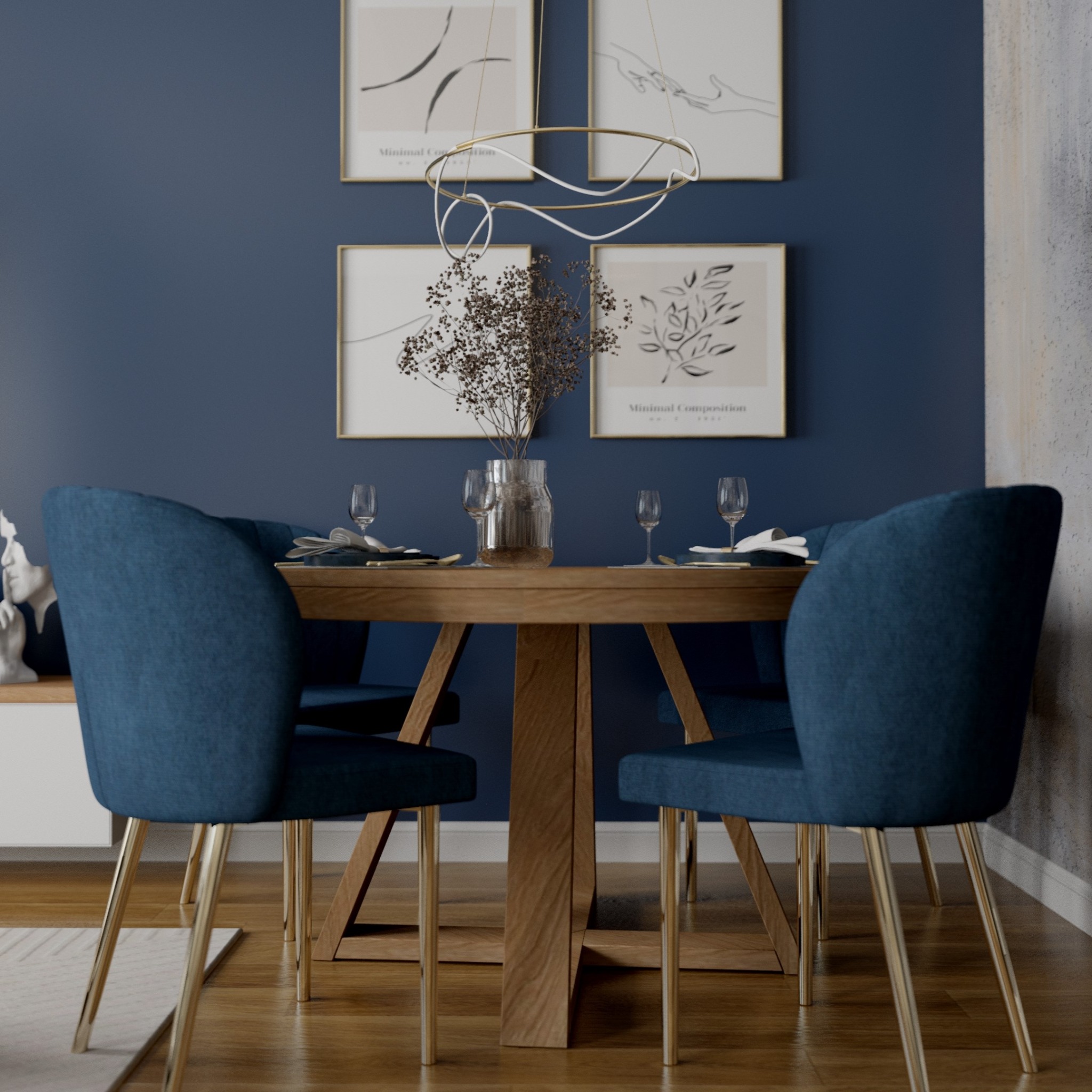 Jadalnia w odcieniach granatu i drewna: stół z nakryciem, krzesła z aksamitnym obiciem na złotych nogach, abstrakcyjne grafiki na ścianie i designerska lampa wisząca.