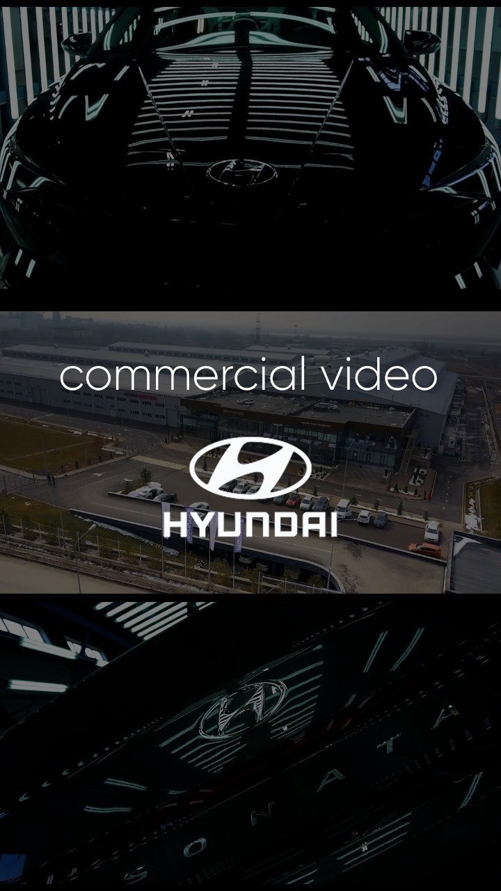 Ujęcie z planu filmowego reklamy samochodu Hyundai, z widocznym logo i nazwą marki na tle fabryki.