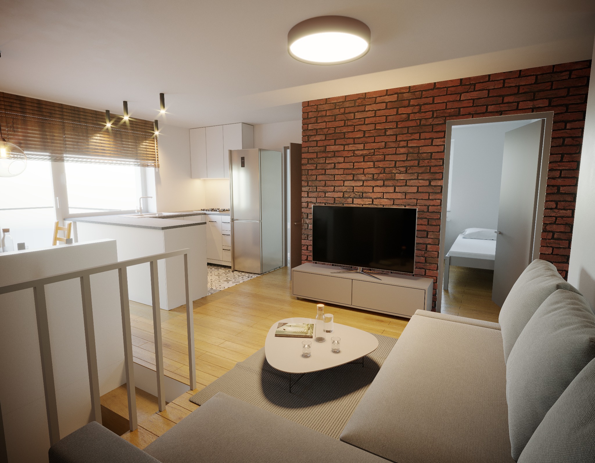 Nowoczesne wnętrze mieszkania z ceglaną ścianą, drewnianą podłogą, szarą sofą i otwartą kuchnią z białymi meblami oraz oświetleniem punktowym, widok na sypialnię w tle.