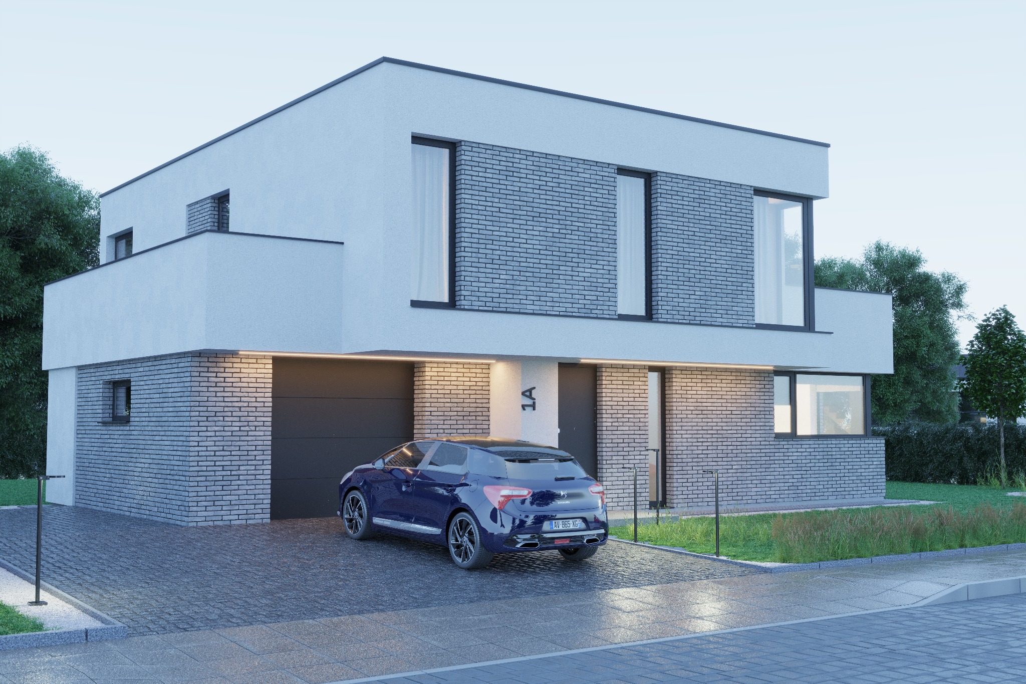 Nowoczesny, dwukondygnacyjny dom z płaskim dachem, elewacją z białego tynku i szarych cegieł, oświetlony od dołu, z ciemnoszarym garażem i granatowym samochodem na brukowanym podjeździe.