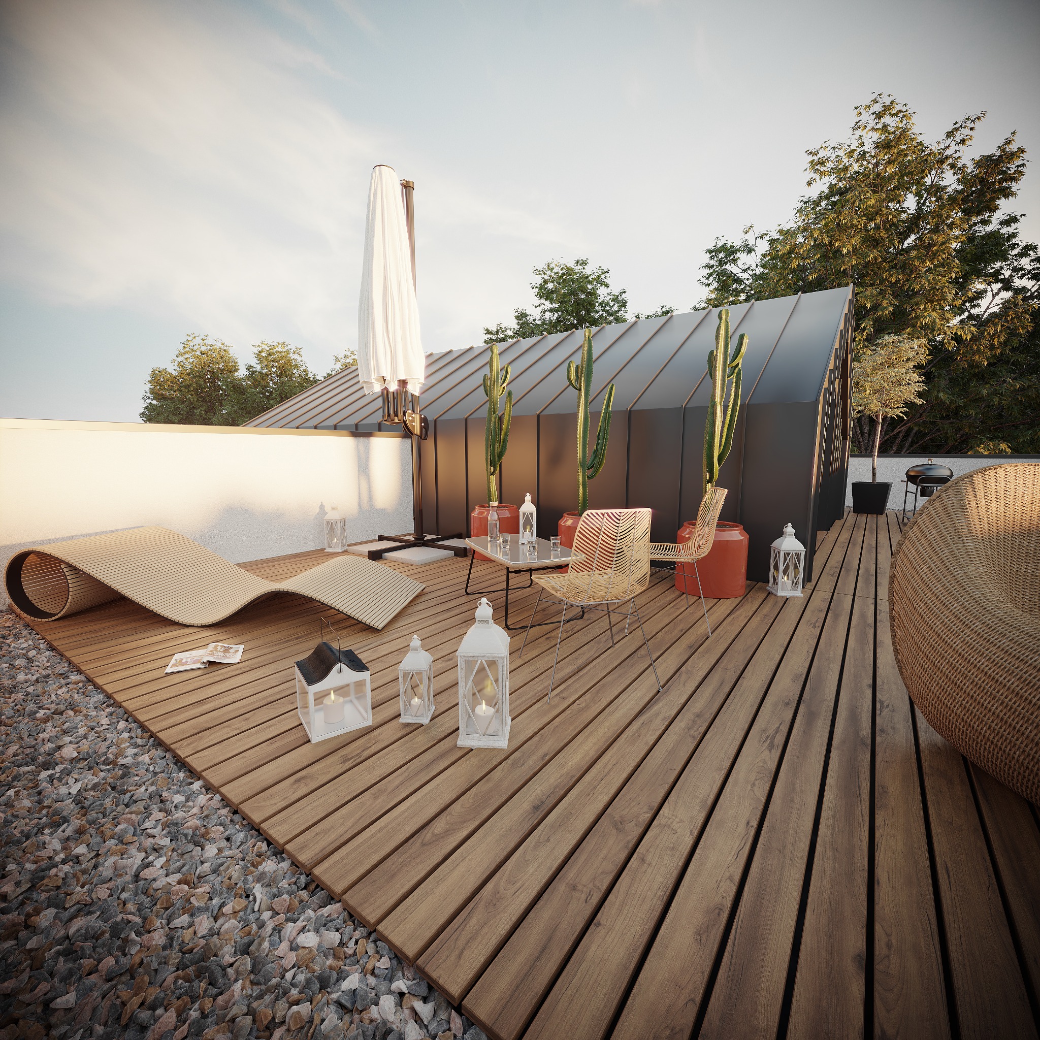 Aranżacja tarasu na dachu z drewnianą podłogą, leżakiem, stolikiem i kaktusami w donicach, oświetlona lampionami, z widokiem na zieleń i fragment grilla.