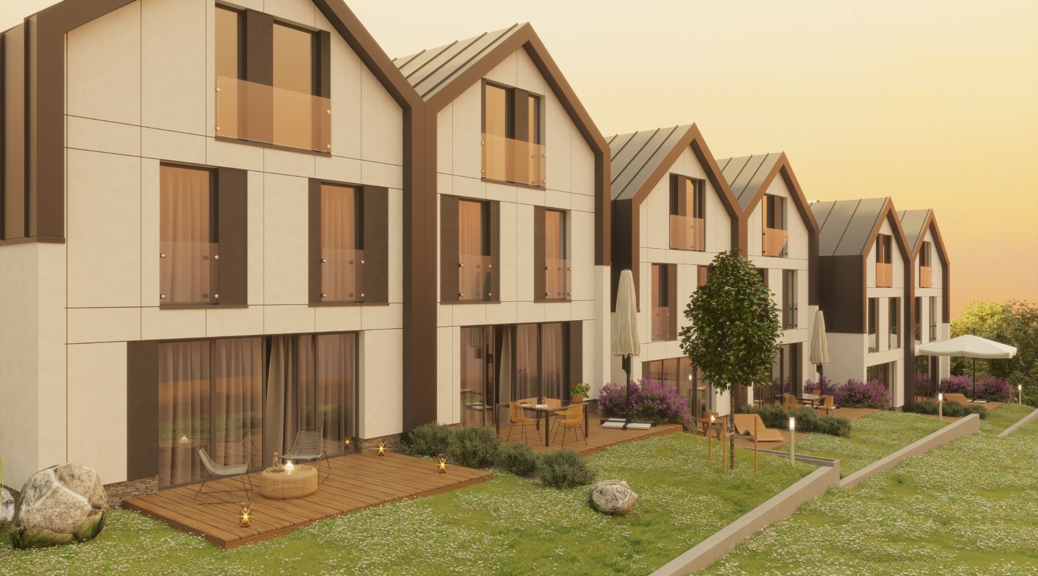 Wizualizacja szeregu nowoczesnych domów z białymi elewacjami, brązowymi obramowaniami okien i szarymi dachami, każdy z drewnianym tarasem i meblami ogrodowymi, otoczonych zielonym trawnikiem...