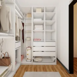 Biała, nowoczesna garderoba z wyposażeniem w Pruszczu Gdańskim, obejmująca półki, szuflady, wiszące ubrania, torebkę i dekoracyjną walizkę, oświetlona listwami LED.