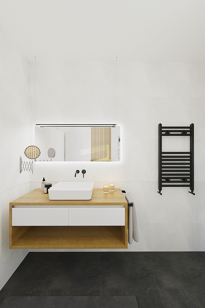 Nowoczesna łazienka z wiszącą szafką z drewnianym blatem i białą umywalką, podświetlane lustro, czarny grzejnik drabinkowy i ciemna podłoga.