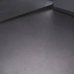 Szara, matowa podłoga z płytek gresowych z delikatnym wzorem, wykończona metalową listwą przy progu.