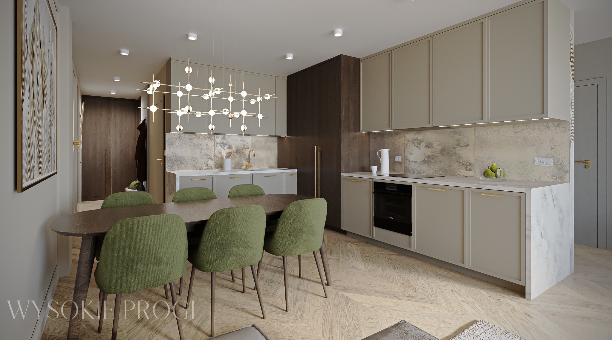 Wnętrze mieszkania z otwartą kuchnią na salon z drewnianym stołem i zielonymi krzesłami, nad stołem designerska lampa, na podłodze parkiet w jodełkę.