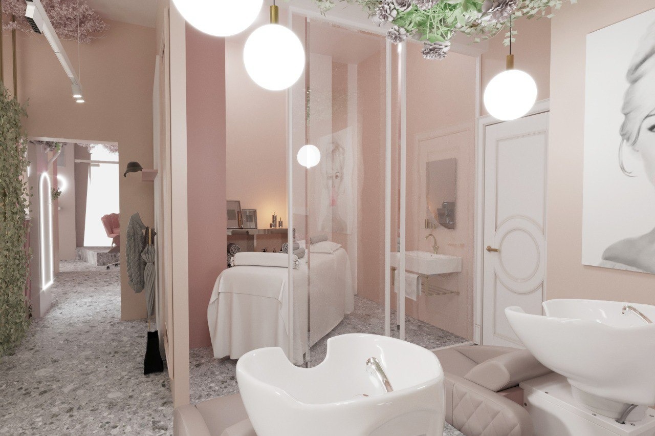 Pastelowe wnętrze salonu kosmetycznego z białymi meblami, umywalkami fryzjerskimi i leżanką kosmetyczną, oświetlone kulistymi lampami i ozdobione roślinami.