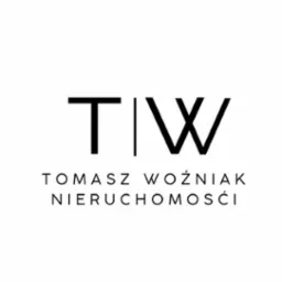 Minimalistyczne logo firmy Tomasz Woźniak Nieruchomości, czarne litery TW oddzielone pionową linią na białym tle.
