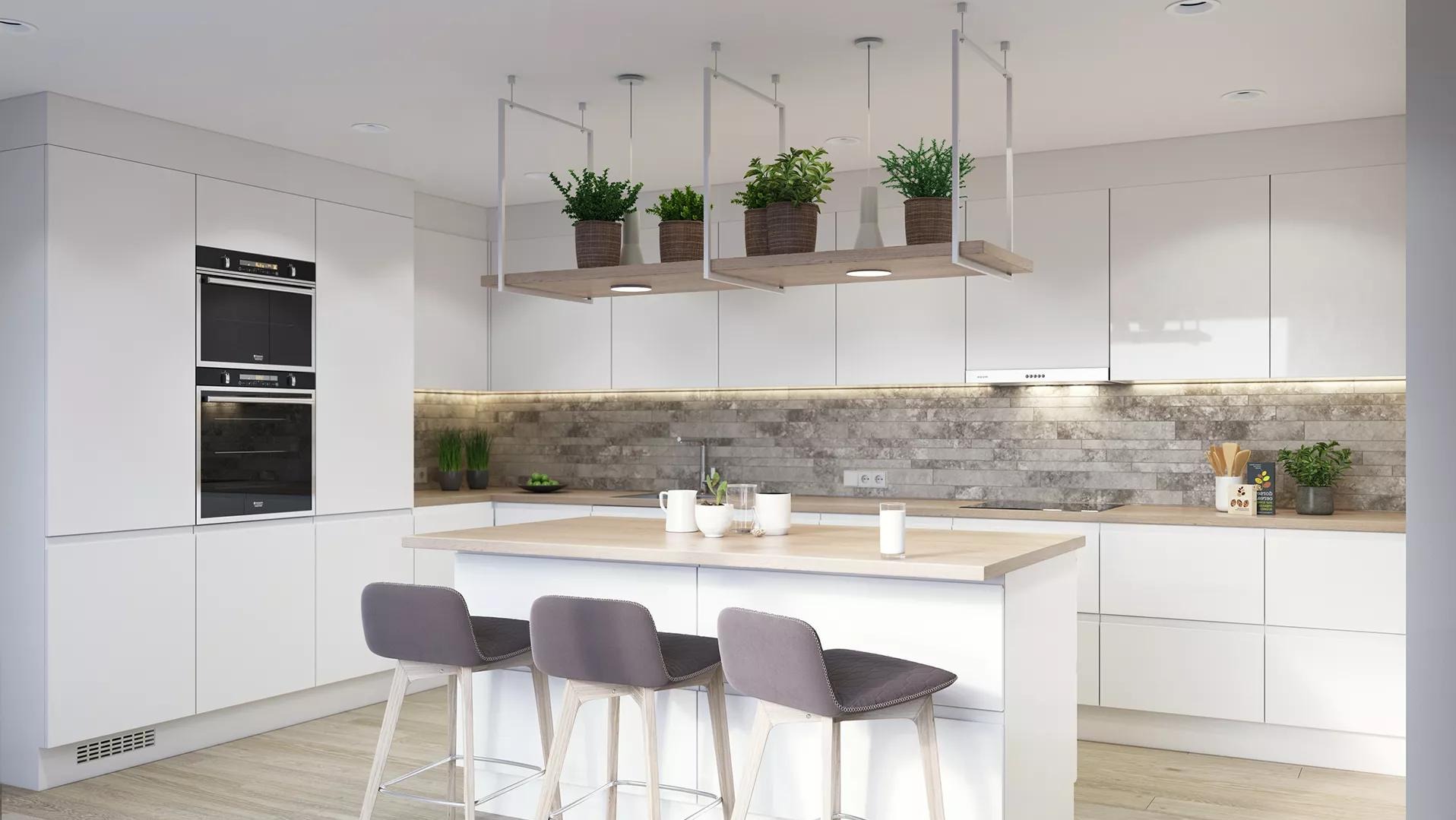 Jasna kuchnia w nowoczesnym stylu: białe szafki, wyspa z szarymi hokerami, ceglana ściana nad blatem i wisząca półka z roślinami doniczkowymi.