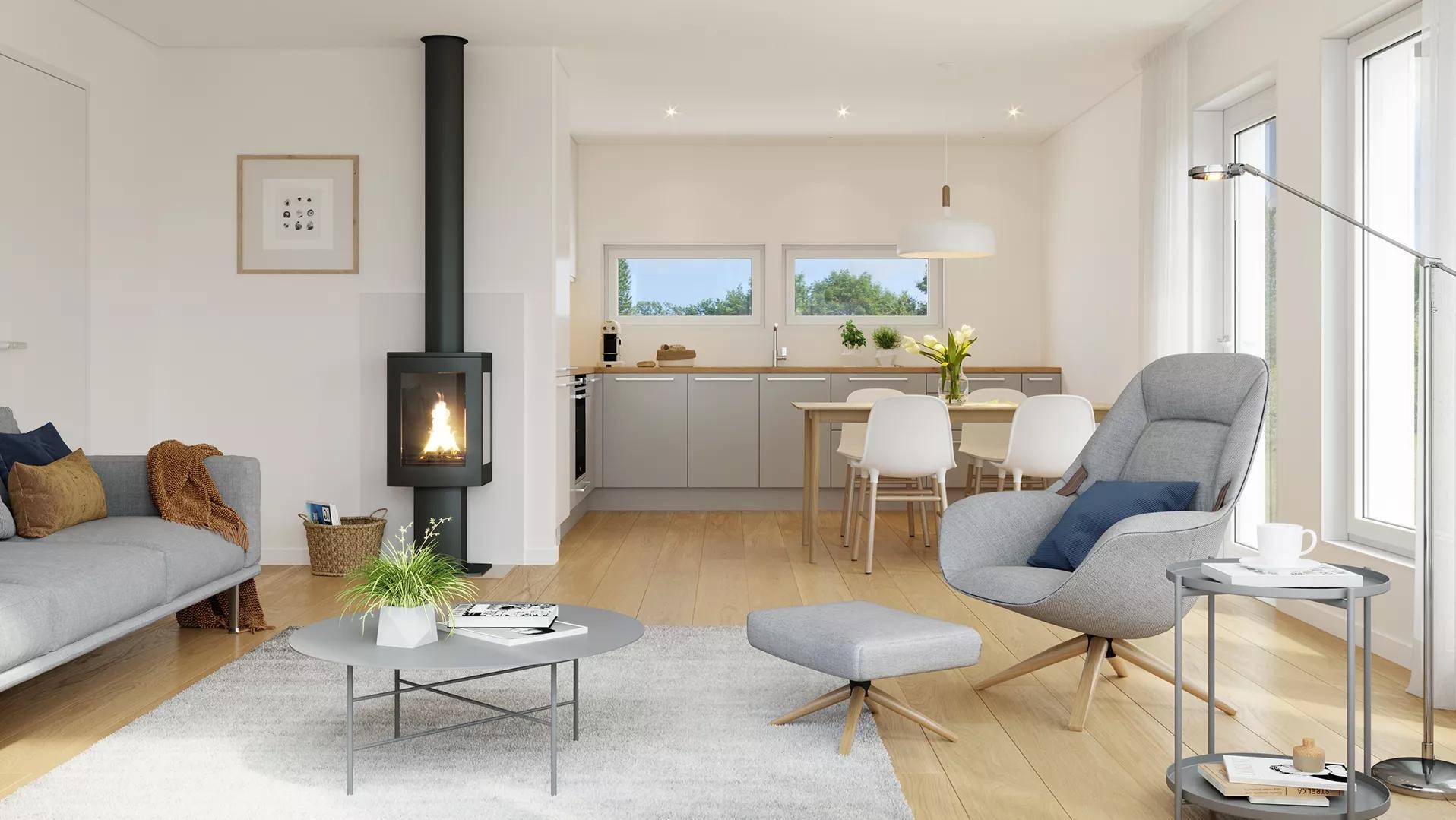 Jasne wnętrze domu z drewnianą podłogą, szarą sofą, kominkiem i kuchnią w tle. Nowoczesny design z dużym oknem i subtelnym oświetleniem.