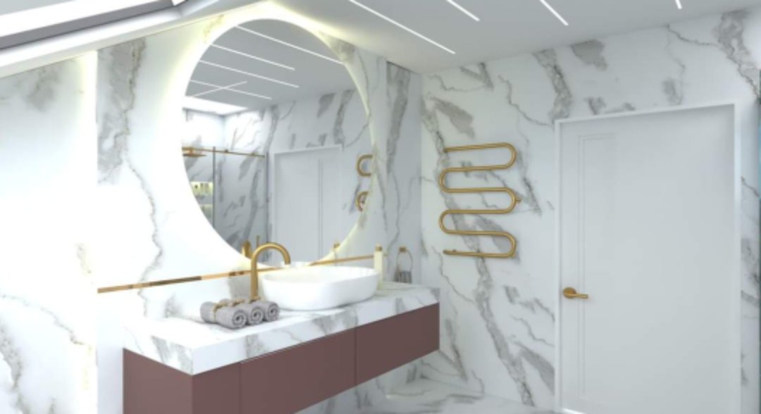 Nowoczesna łazienka z marmurowymi ścianami, okrągłym lustrem z podświetleniem LED, wiszącą szafką z umywalką, złotą armaturą i grzejnikiem drabinkowym.