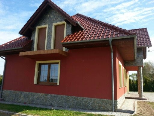 Wykonanie Elewaji budynku wraz z wyłorzeniem kamienia naturalnego,,Łupka `` na cokol,filarach,lukarnach.