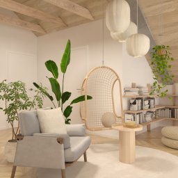 Materia design studio - Jasne wnętrze z drewnianym stropem belkowym, fotelem z poduszkami, wiszącym fotelem-kokonem, okrągłym stolikiem, roślinami w doniczkach i półkami z książkami.