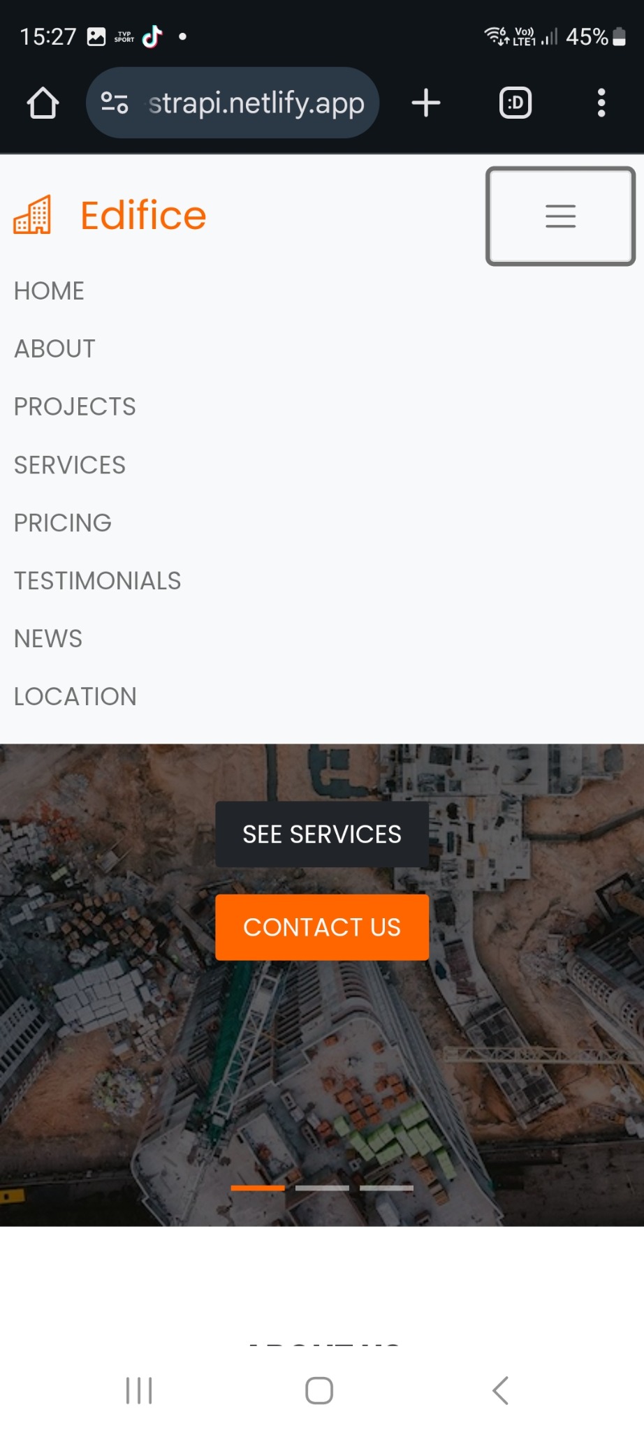 Strona internetowa firmy budowlanej Edifice na urządzeniu mobilnym, widok z lotu ptaka na plac budowy w tle, menu z opcjami HOME, ABOUT, PROJECTS, SERVICES, PRICING, TESTIMONIALS, NEWS, LOCATION...