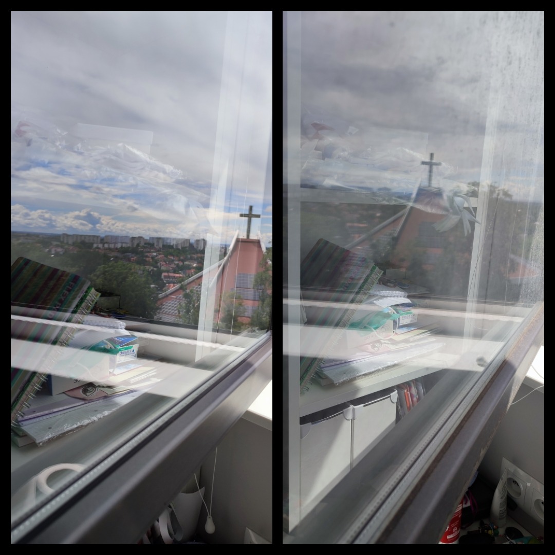 Brudne okno z widokiem na miasto i kościół, na parapecie leżą notatniki i inne przedmioty.