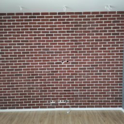 Stol-Lux - Ściana z cegły klinkierowej w odcieniach czerwieni z białymi fugami, widoczne otwory na gniazdka elektryczne i przewody pod sufitem, panele podłogowe w kolorze jasnego drewna.