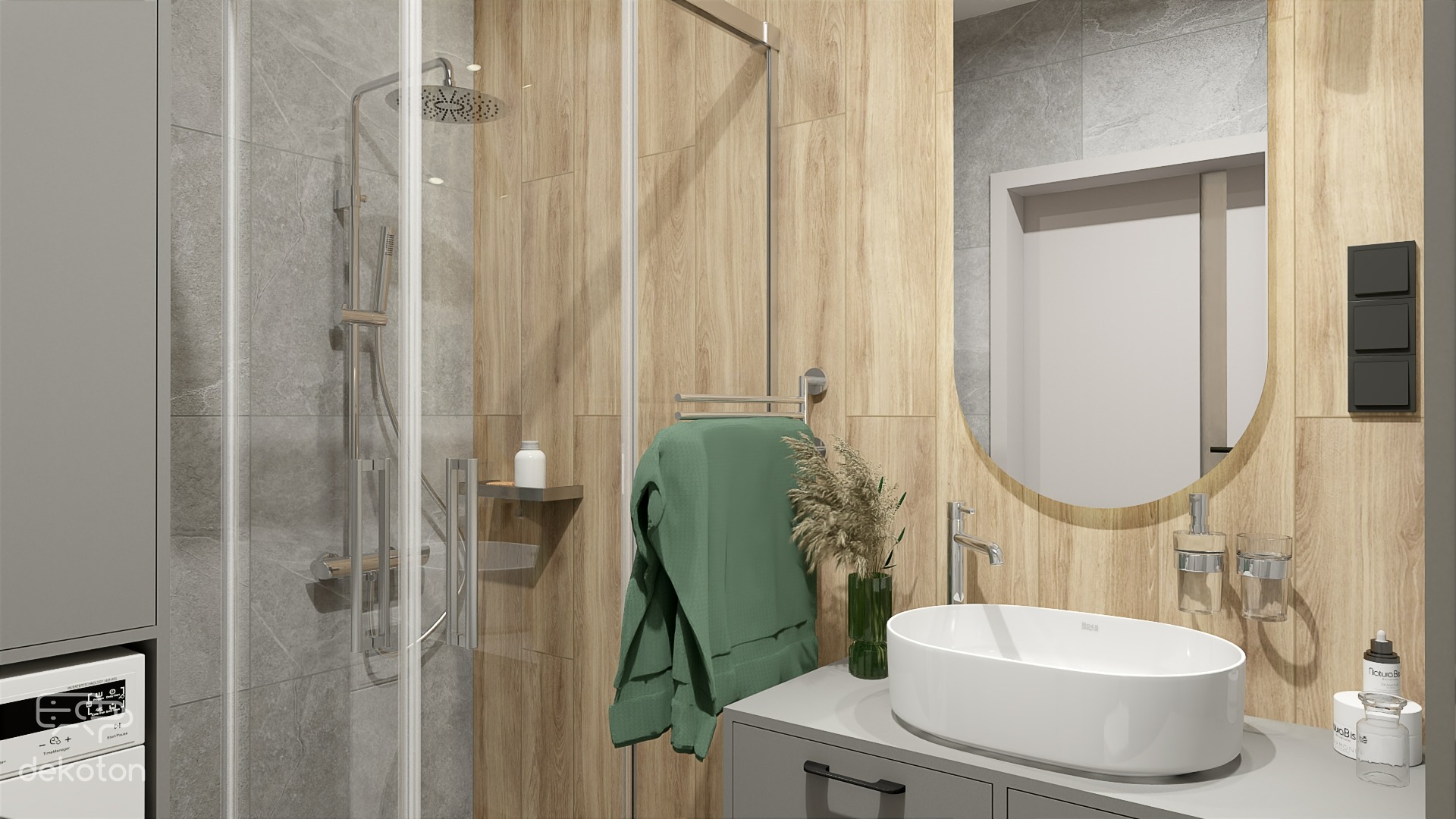 Nowoczesna łazienka z kabiną prysznicową typu walk-in, umywalką nablatową i drewnopodobnymi płytkami ściennymi, akcentowana zielonym ręcznikiem i dekoracyjną trawą w szklanym wazonie.