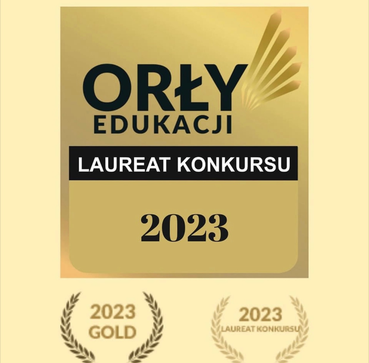 Złota plakietka 'Orły Edukacji' z napisem 'Laureat Konkursu 2023' oraz wieńcami laurowymi, symbolizująca nagrodę w konkursie edukacyjnym.