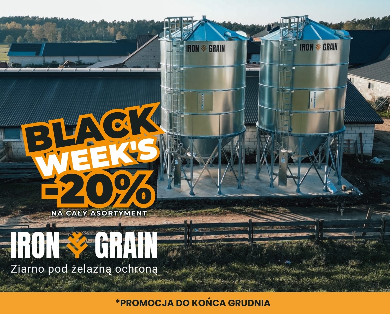 Dwa srebrne silosy zbożowe Iron Grain na tle zabudowań gospodarczych, z grafiką promocyjną Black Week's -20% na cały asortyment.