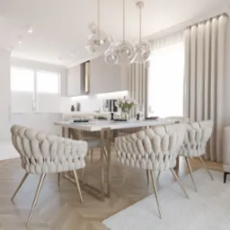 Jasne wnętrze jadalni z otwartą kuchnią, krzesła z welurowym obiciem w kolorze écru, stół z białym blatem i złotymi nogami, szklany żyrandol w kształcie kuli, parkiet w jodełkę, biały dywan.