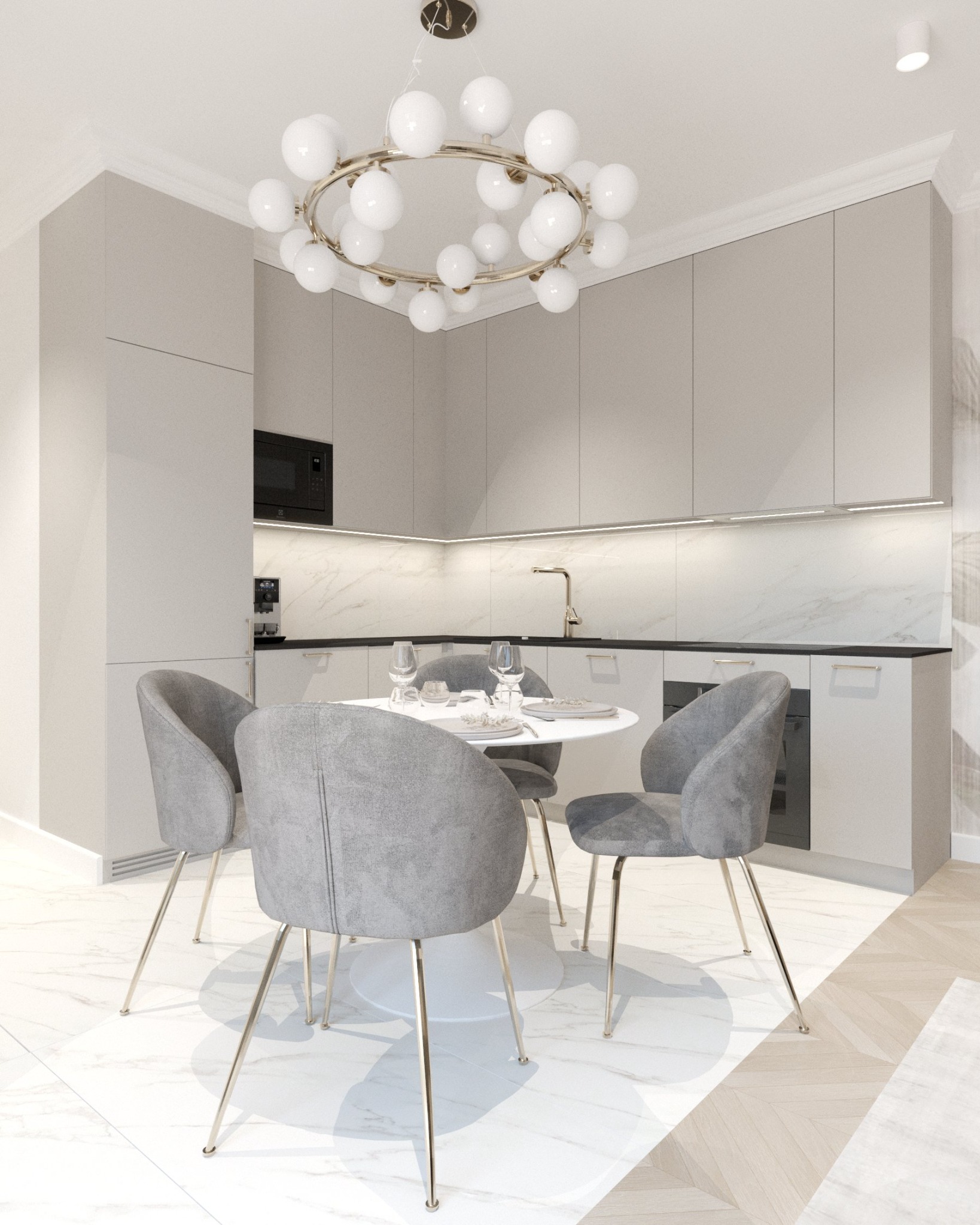 Jasna kuchnia z okrągłym stołem, szarymi krzesłami na złotych nóżkach i designerską lampą z białych kul.