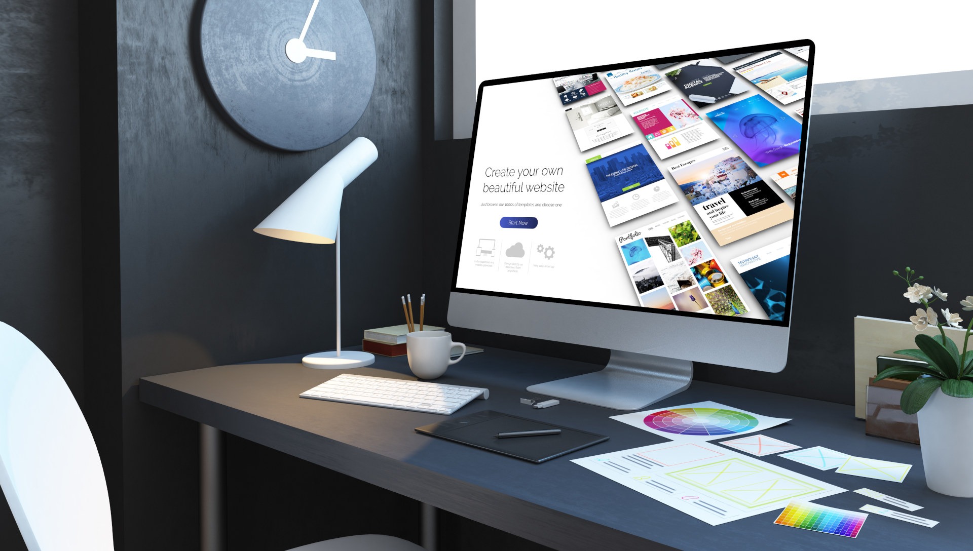 Biurko z komputerem wyświetlającym szablon strony internetowej, tablet graficzny, paleta kolorów i szkice układu strony.