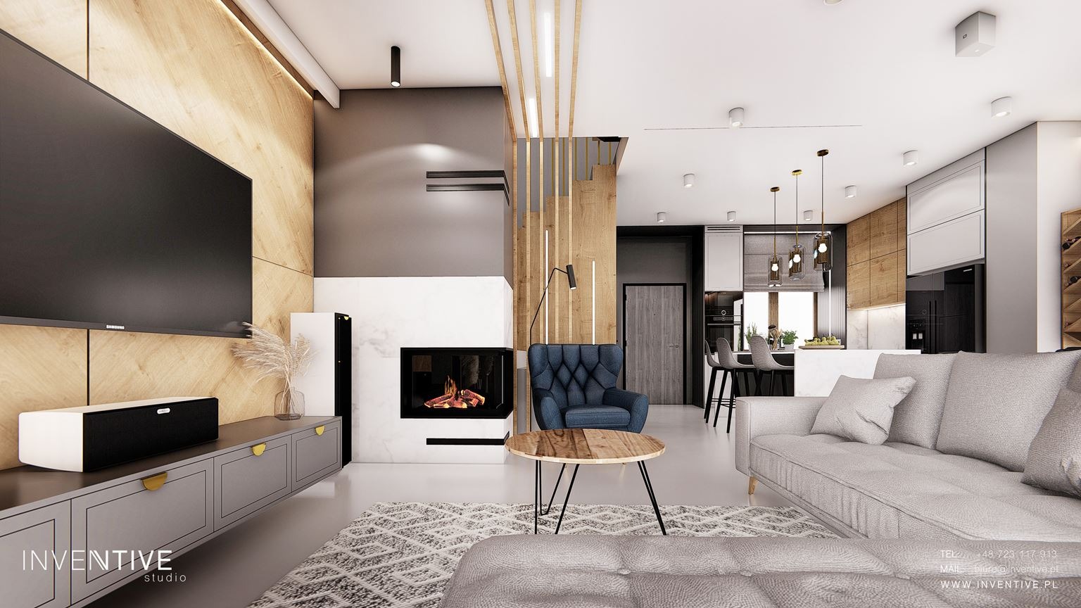 Salon z otwartą kuchnią w nowoczesnym stylu: szara sofa, wzorzysty dywan, kominek obłożony marmurem, niebieski fotel klubowy i drewniane panele ścienne tworzą przytulną przestrzeń.