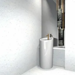 Minimalistyczna łazienka z wolnostojącą, białą umywalką o owalnym kształcie i złotą armaturą na tle ściany z szarego betonu architektonicznego oraz dekoracyjnych wieszaków na ręczniki.