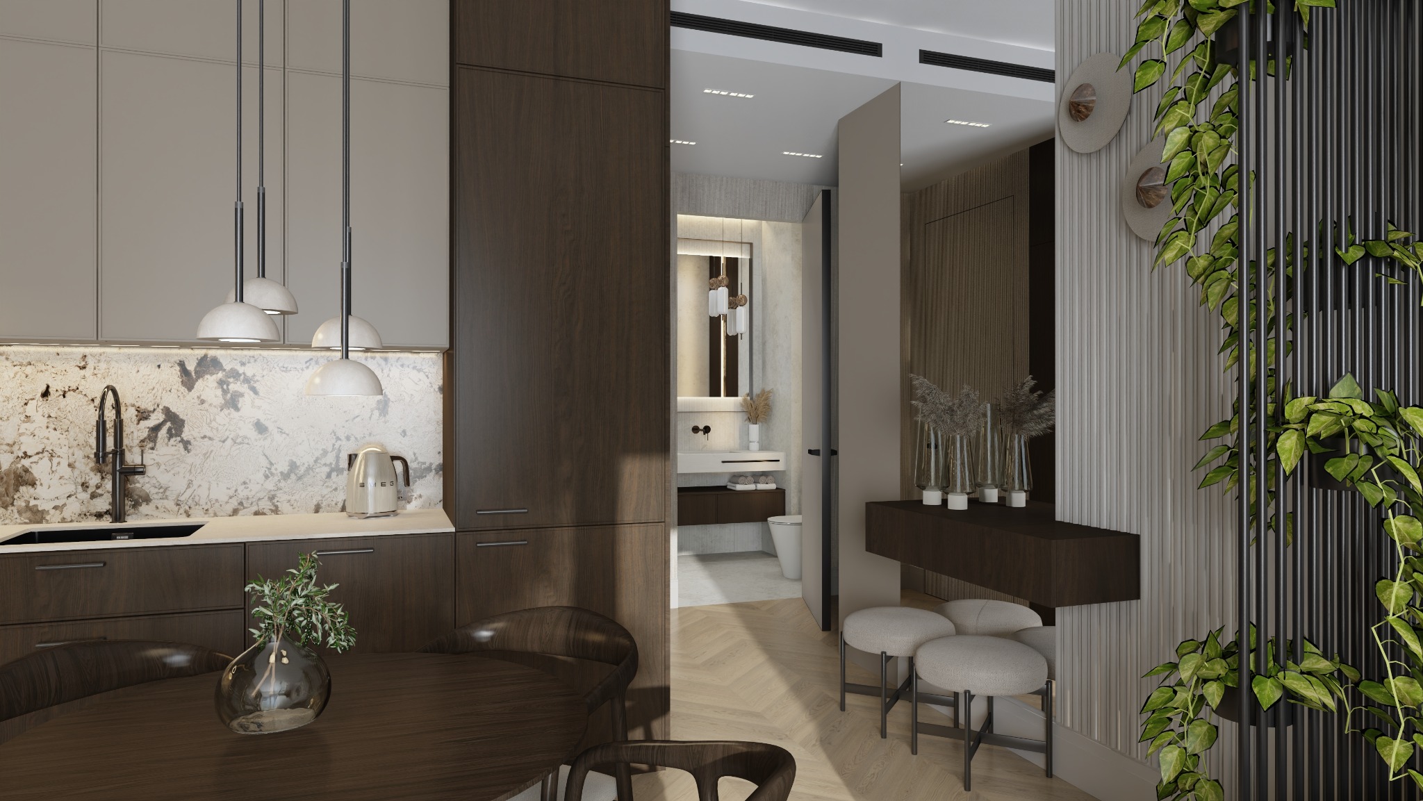 Nowoczesne wnętrze: kuchnia z ciemnymi szafkami, marmurowy backsplash, okrągły stół z rośliną, widok na łazienkę i dekoracyjną ścianę z roślinami.