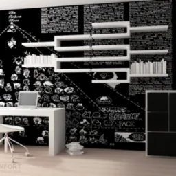 Nowoczesne biuro z białym biurkiem, krzesłem i półkami na tle ściany z komiksowym motywem, laptop na biurku, minimalistyczny styl.