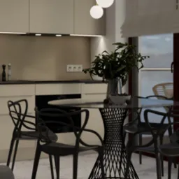 Beżowa kuchnia z okrągłym stołem z czarnymi krzesłami i dekoracyjną rośliną w wazonie na blacie, oświetlona wiszącymi lampami kulami.