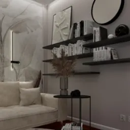 Beżowa sofa z poduszkami, okrągły dywan, stolik kawowy z wazonem z suszonymi trawami i aparatem, półki z książkami, okrągłe lustro i grafika na ścianie z motywem roślinnym.