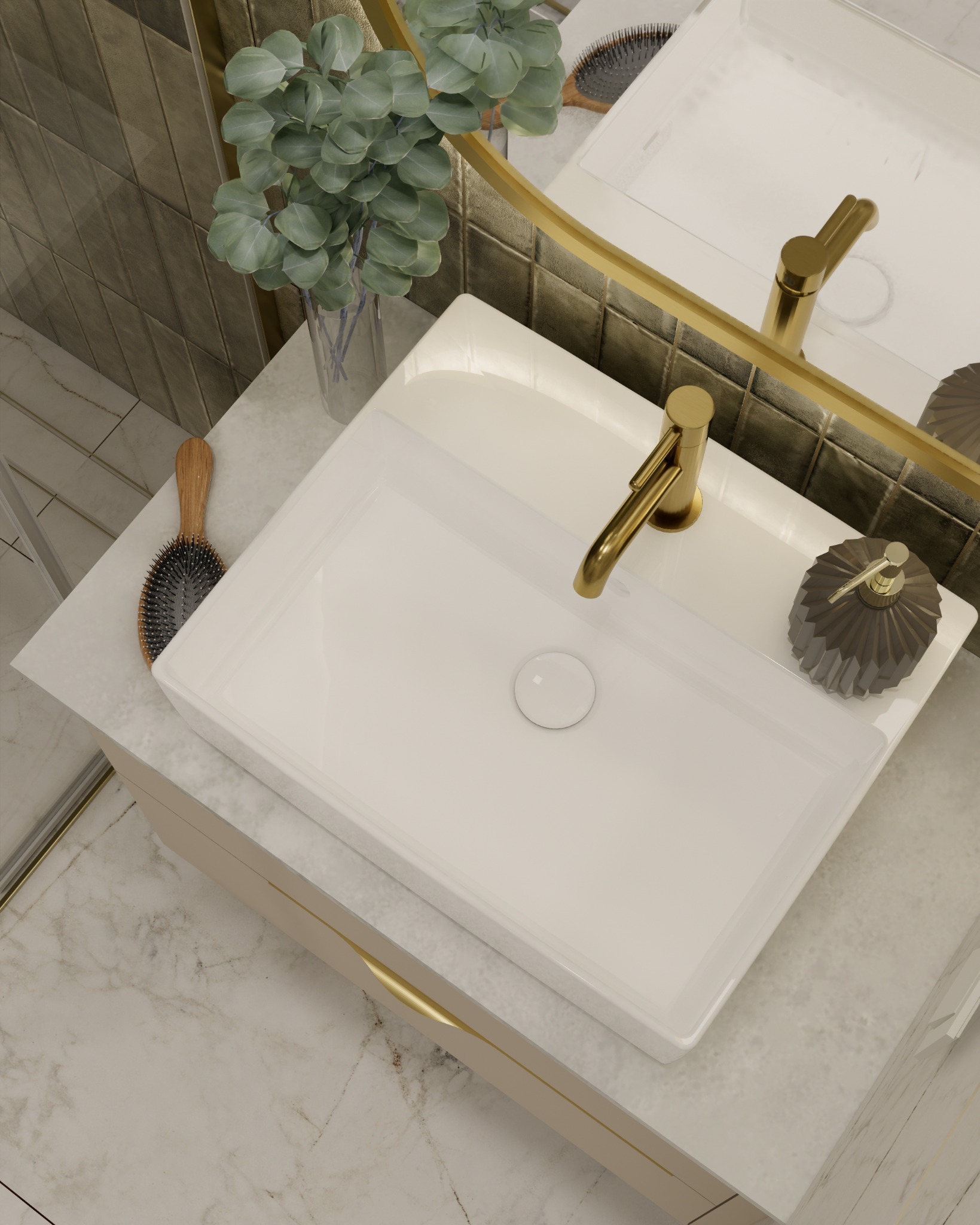 Wnętrze łazienki z umywalką nablatową, złotą armaturą, lustrem w złotej ramie i dekoracyjnymi akcentami, takimi jak roślina w szklanym wazonie i dozownik mydła o fasetowanej powierzchni.