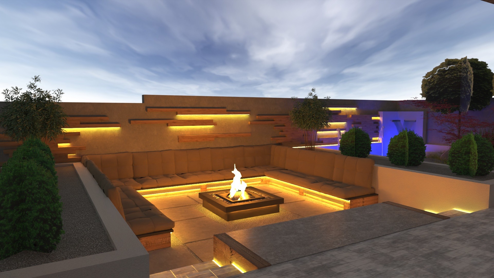 Oświetlona strefa relaksu w ogrodzie z paleniskiem, sofami i wodospadem podświetlonym na niebiesko.