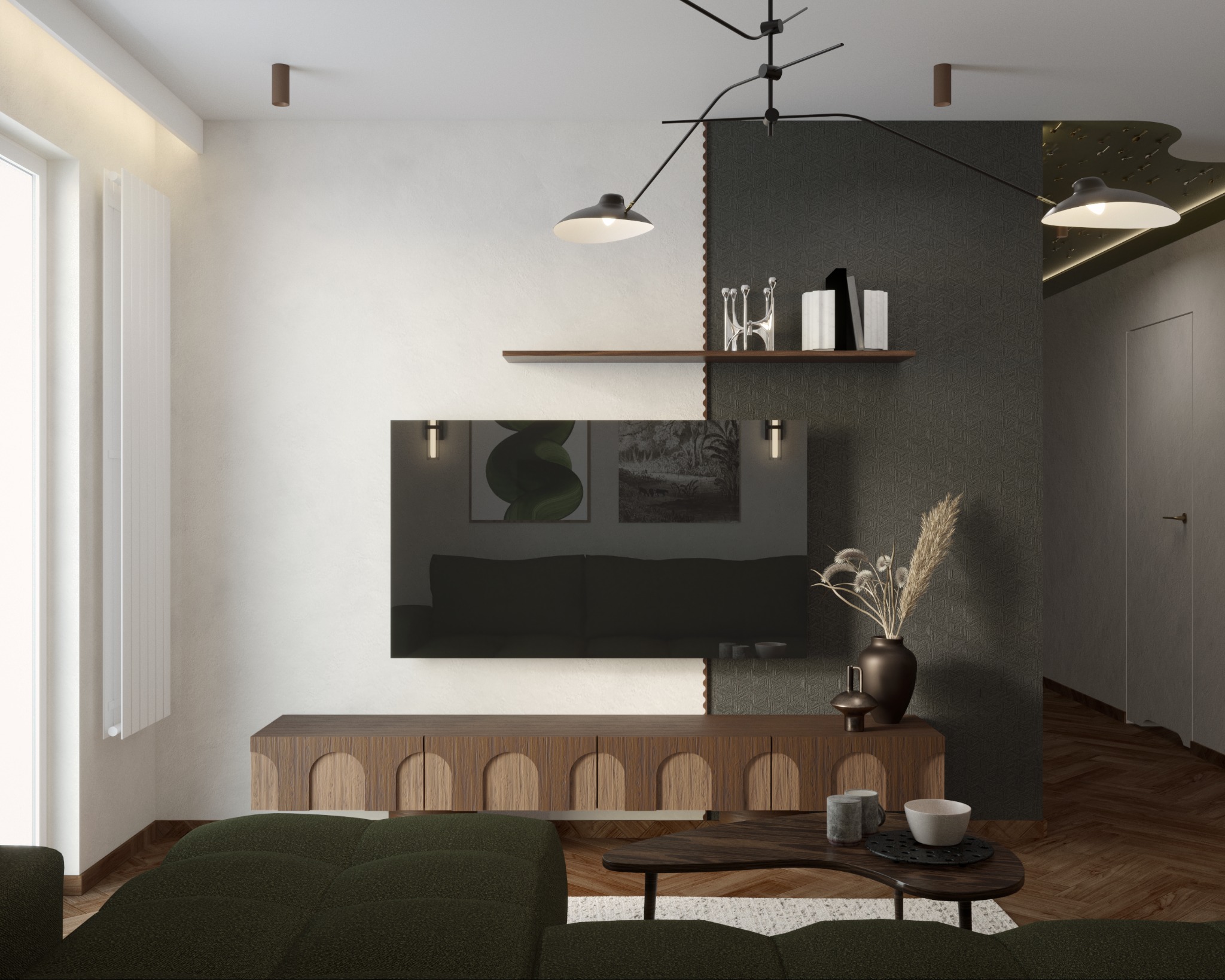 Nowoczesny salon z zieloną sofą, drewnianą szafką RTV i czarno-białą ścianą akcentową. Na ścianie półki z dekoracjami i czarny telewizor. Całość oświetlona wiszącą lampą.