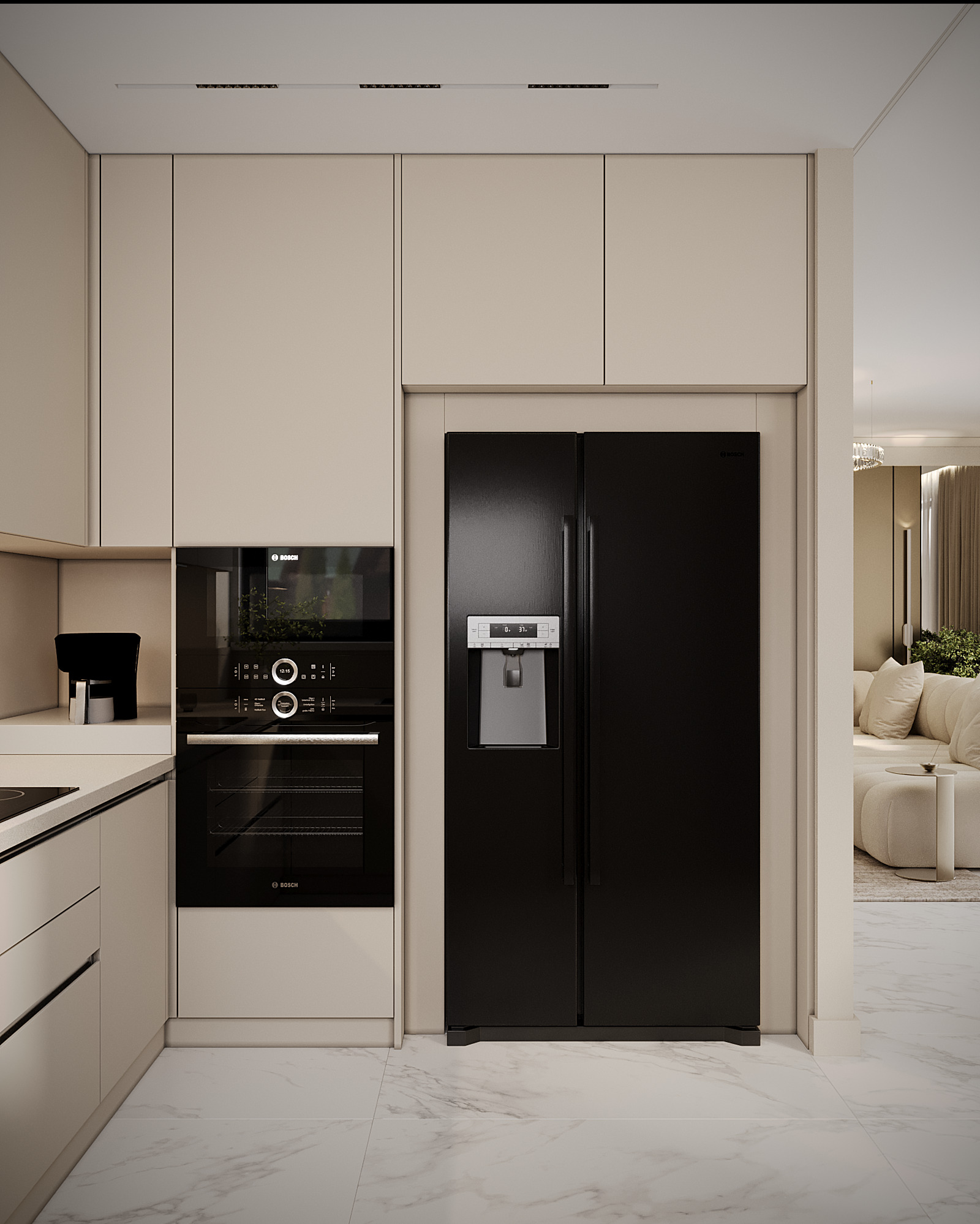 Minimalistyczna kuchnia w beżach z czarną lodówką side-by-side i piekarnikiem w zabudowie. Marmurowe płytki podłogowe i widok na salon w tle.