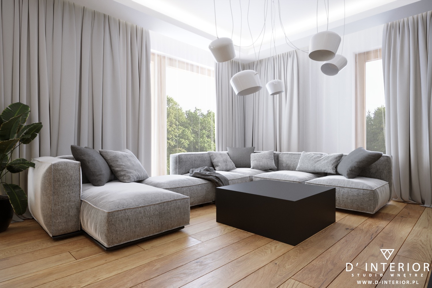 Jasny salon z modułową sofą w odcieniach szarości, czarnym stolikiem kawowym i drewnianą podłogą. Nad sofą zwisają nowoczesne, białe lampy. Za oknami widoczna zieleń drzew.