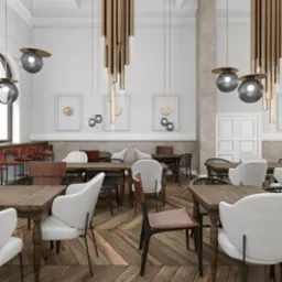 Wnętrze restauracji z drewnianymi stołami, krzesłami w odcieniach bieli, brązu i czerni, parkietem ułożonym w jodełkę oraz nowoczesnymi lampami wiszącymi.