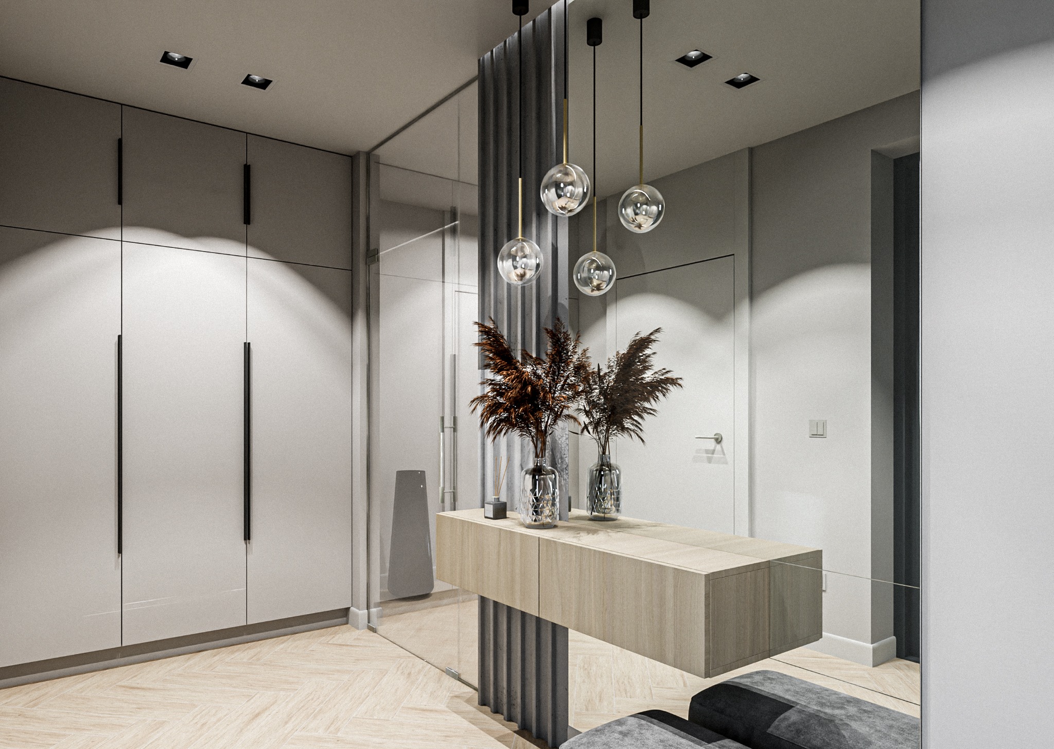 Nowoczesna aranżacja przedpokoju z lustrem, drewnianą konsolą, dekoracyjnymi wazonami z suszonymi trawami i wiszącymi lampami kulami, widoczna szafa w zabudowie i parkiet w jodełkę.