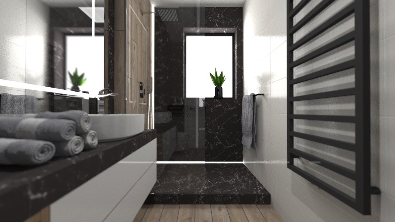 Nowoczesna łazienka z czarnym marmurem, białymi szafkami i drewnianą podłogą. Na blacie umywalki leżą zwinięte szare ręczniki. W tle kabina prysznicowa i grzejnik.