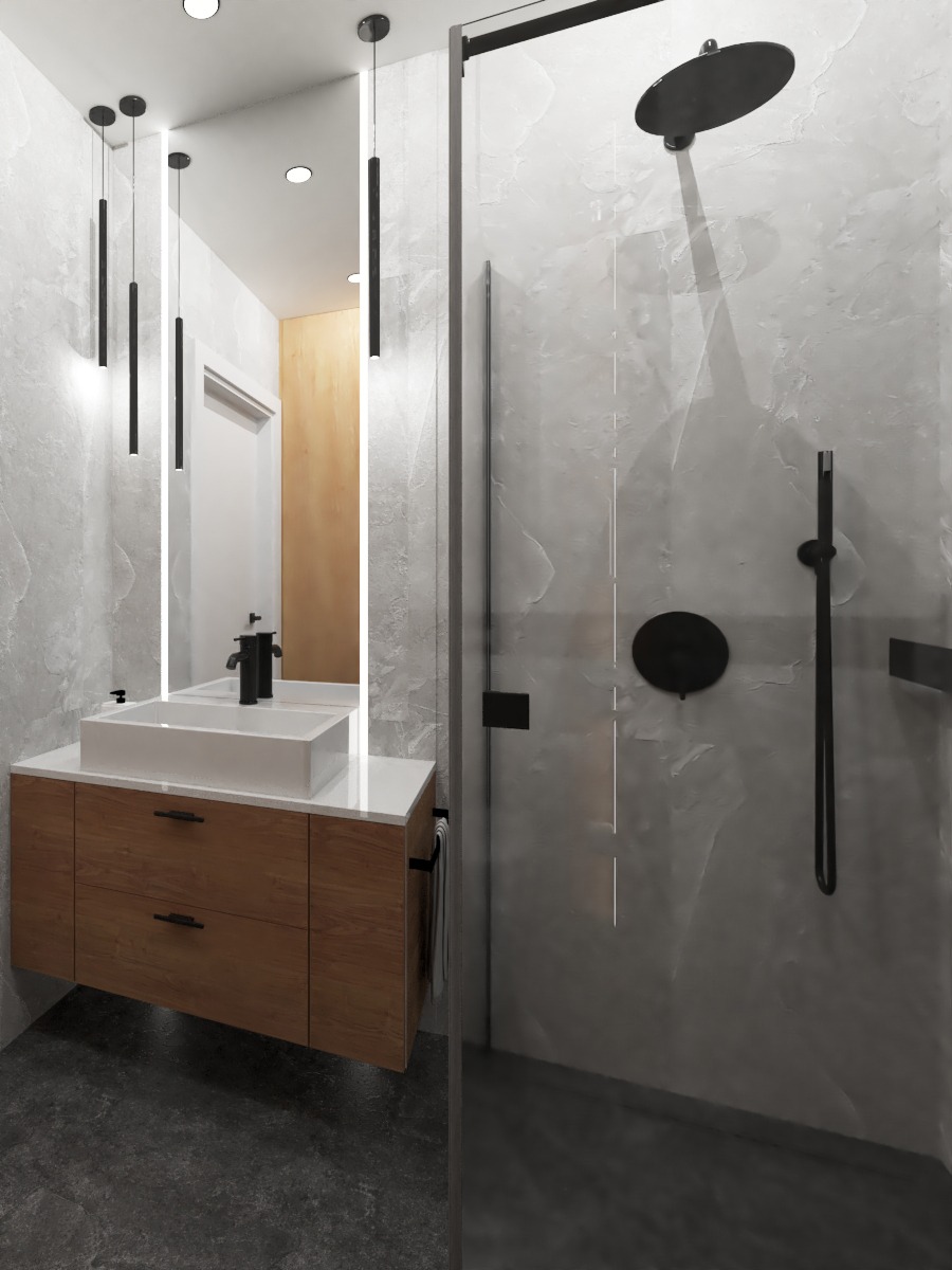 Nowoczesna łazienka z drewnianą szafką pod umywalką, białym blatem, czarną armaturą i kabiną prysznicową ze szklaną ścianą, oświetlona wiszącymi lampami.